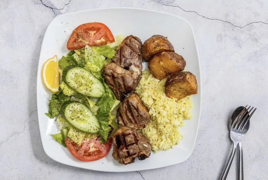 Lamb Chops with rice, salad and Greek-style potatoes